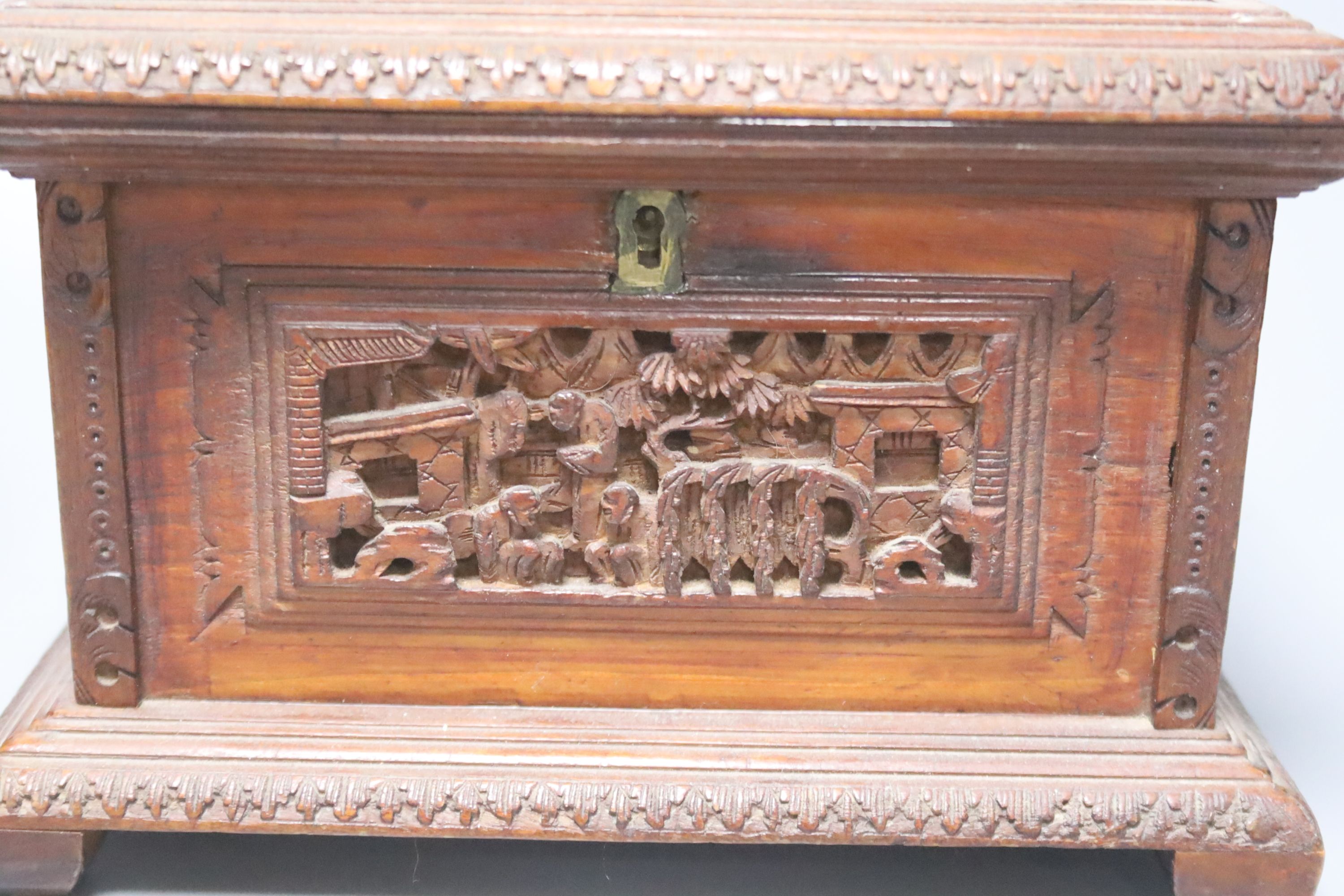 Three 19th century Chinese carved sandalwood caskets, longest 19cm